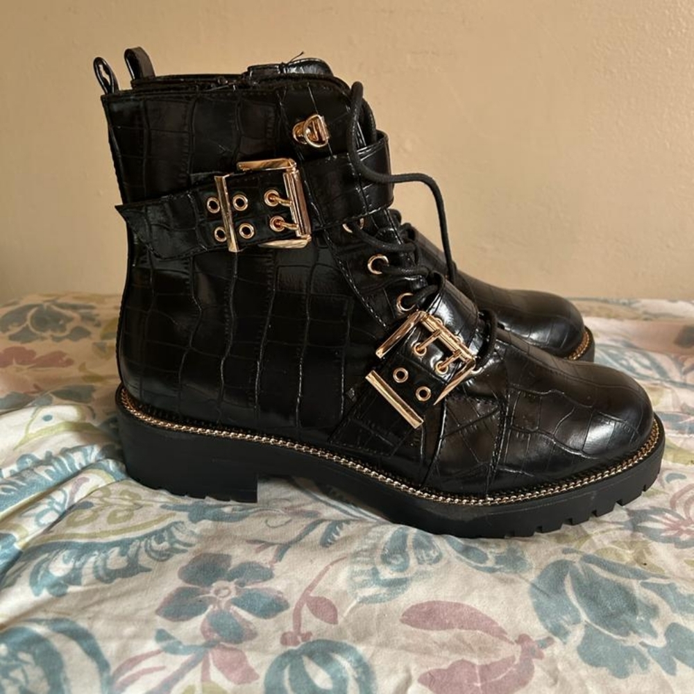 Black and gold lace-up boots
